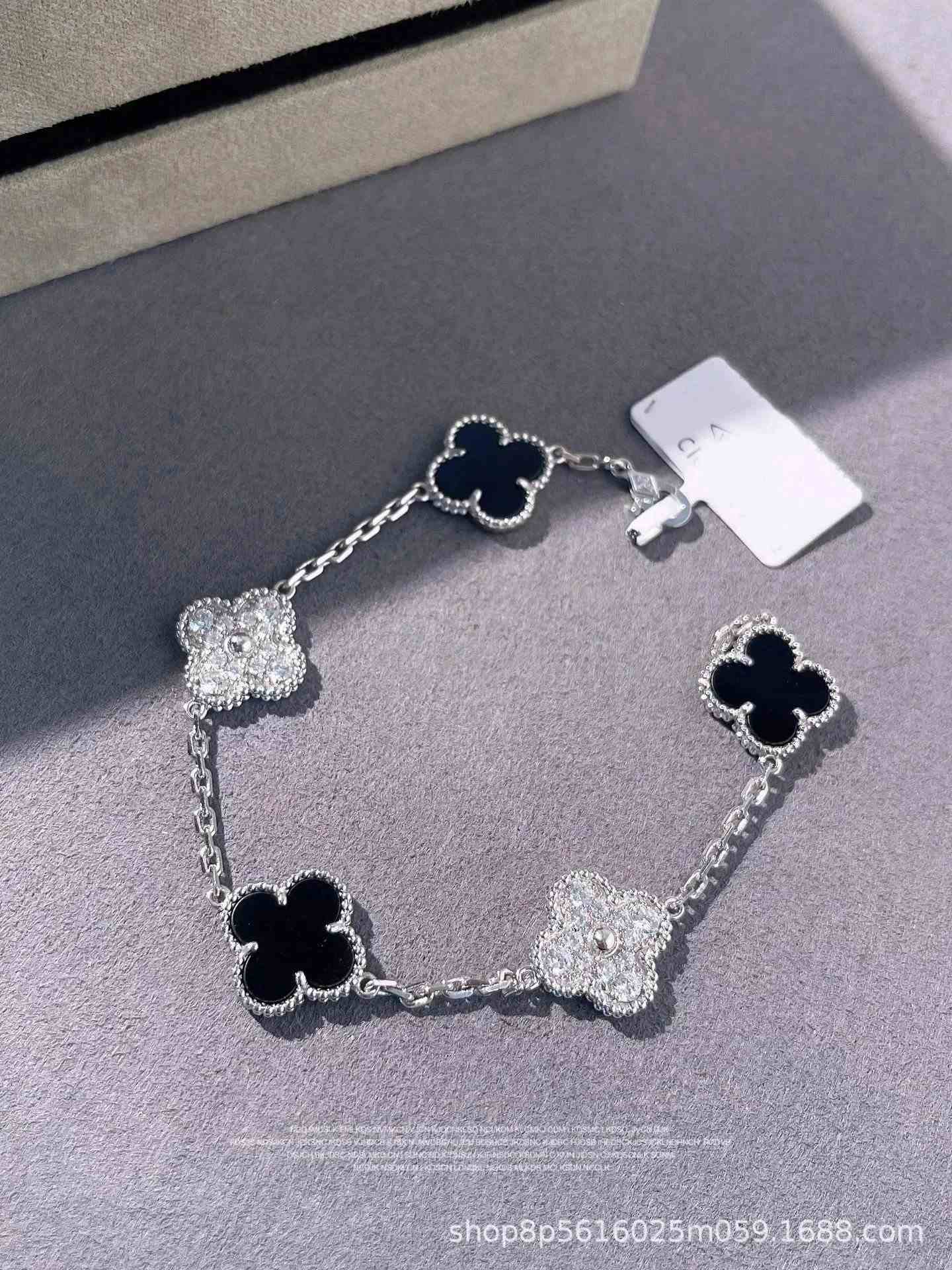 White gold black agate with diamonds